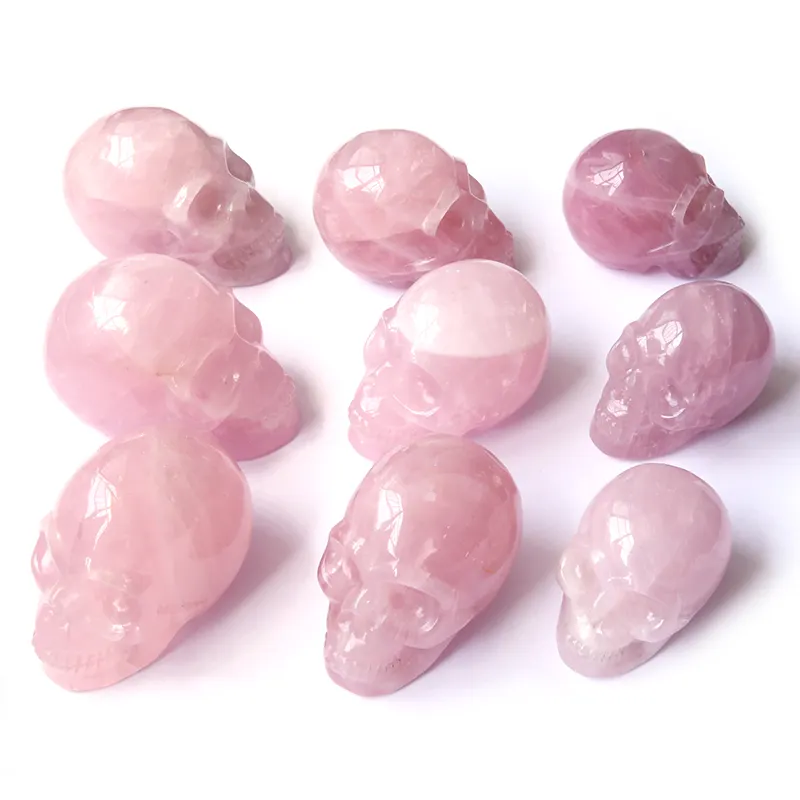 Caveiras de cristal de quartzo rosa natural, esculpidas à mão de alta qualidade para venda
