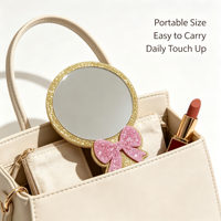 Miroir cosmétique portable à paillettes avec nœud rose et cadre doré, personnalisable avec logo, idéal pour cadeau promotionnel et ornement de bureau