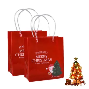 นํากลับมาใช้ใหม่แบบพกพาขายส่งกันน้ํา PVC Candy เครื่องประดับกระเป๋าสิริสีแดงคริสต์มาสพลาสติกช้อปปิ้งถุงของขวัญพร้อมที่จับ