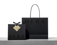 Sac en papier noir biodégradable de luxe personnalisé avec marquage à chaud doré et poignée en ruban pour emballage de produits de beauté haut de gamme