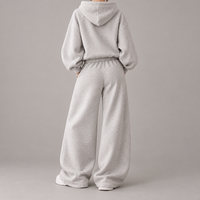 Ensemble de survêtement décontracté pour femme, personnalisé OEM, avec sweat à capuche et pantalon de survêtement à jambes larges, couleur unie, coupe oversize, fabricant de marque privée