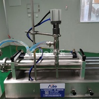 Machine de remplissage de liquides semi-automatique à buse unique pneumatique de haute qualité pour les produits cosmétiques, les parfums, les boissons et les huiles