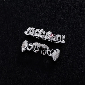 Joyería de fiesta: Grillz dentales de Hip Hop con patrón de estrellas, de aleación de zinc plateada, con engaste de canal en forma de lágrima G 026HCG 322 - Product Image 1