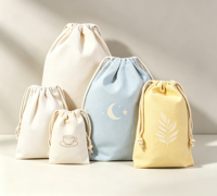 Vente en gros de grandes pochettes à cordon en tissu non tissé personnalisées, imprimées, réutilisables, anti-poussière, recyclables, pour le rangement de cosmétiques et de bijoux