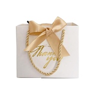 Petits sacs-cadeaux portables de luxe or et blanc avec ruban pour bijoux montres cosmétiques vêtements pour mariages merci impressions