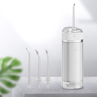 Hydropulseur rechargeable pour le nettoyage des dents avec trois buses et sac de voyage