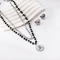 Bijoux de mode personnalisés Oeil du mal Colliers et boucles d'oreilles en acier inoxydable Superposition de perles noires Chaîne Collier Boucles d'oreilles Ensemble
