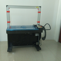 Machine d'emballage entièrement automatique pour la cerclage de cartons avec des courroies PP/PE de 5 mm, idéale pour la fixation de boîtes.