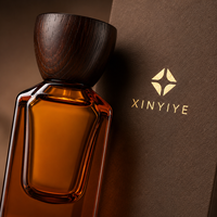 Flacon de parfum vide en ambre de 50 ml, structure à double paroi unique, bouchon en bois, impression personnalisée de la marque, vente en gros