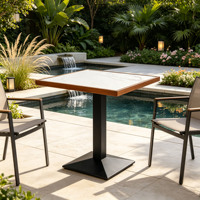 Table en pierre frittée au design rétro, idéale pour les lieux extérieurs tels que les cafés et les restaurants, facile à nettoyer et à ranger.