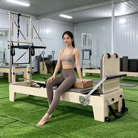 Reformer Pilates demi-tourneur en bois d'érable réglable avec empreinte compacte pour studio de Pilates et espaces restreints
