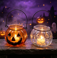 Pot à bougie en verre en forme de citrouille avec poignée en métal pour la décoration d'ambiance du festival d'Halloween