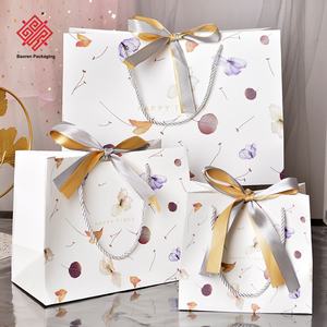 White Paper Cardstock Gift <b>Packaging</b> <b>Bags</b> Carry Leaves Paper <b>Bag</b> <b>Clothing</b> & Snack & Candy <b>Bags</b> Volume Customized LOGO Available - Product Image 2