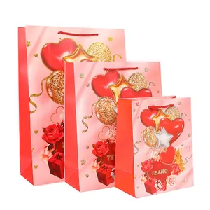 Grosir tas rakit gaya Hari Valentine dengan pola romantis permen dan coklat dalam tas kertas murah ukuran besar