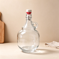 Bouteille en verre transparente à grande capacité avec couvercle basculant et poignée pour huile d'olive extra vierge et sirop