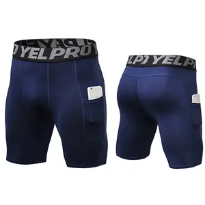 Pantalones cortos deportivos de compresión para entrenamiento de hombre de secado rápido que absorben el sudor con bolsillos