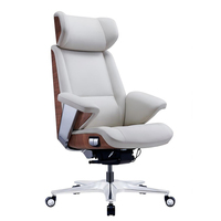 Chaise de bureau de direction luxueuse avec design ergonomique rotatif, dotée d'un coussin d'air et d'un panneau en cuir de noyer