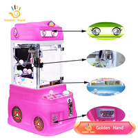 Machine à griffes à main dorée Mini pompier en peluche Machine à poupée pour centre d'amusement