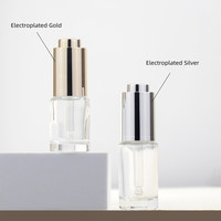 Flacon compte-gouttes en verre de luxe 10ml 15ml 20ml 30ml Flacon vide pour huile essentielle Sérum Transparent Flacon compte-gouttes en verre rotatif à pression