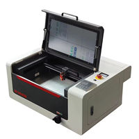 Graveur et graveuse laser CO2 3040 40W refroidi par eau pour métal/caoutchouc avec configuration de table de travail