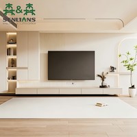 Mur média de luxe discret avec panneaux muraux flottants, bandes LED décoratives et banc de rangement bas pour maison moderne