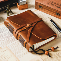 AIGUONIU Vintage Real Leather A5 Notebook Diario de viaje de piel de vaca de capa superior hecho a mano con correa de cierre y páginas recargables