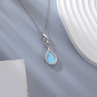 Pendentif en argent sterling 925 éthéré avec un grand larimar bleu naturel, un éclat bleu océan et un design de bélière délicat