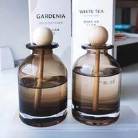 2024 luxe nouveau Design Transparent thé couleur 100ml boule de bois bâton vide verre maison parfum diffuseur bouteille liège étanchéité