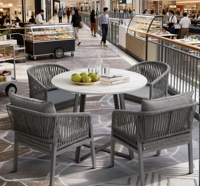 Table et chaises d'extérieur en pierre de style luxe léger, ensemble de table et de chaises de salon de jardin