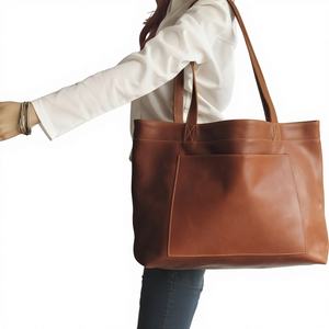 กระเป๋าถือหนังวัวแท้สีพื้นแบบซิป รุ่นปี 2025 แฟชั่นผู้หญิง ทำมือ จุของได้เยอะ ใช้ได้หลากหลาย สะพายไหล่ได้ - Product Image 1