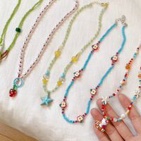 Collier à perles coloré en forme d'étoile de mer orange tendance pour les vacances à la plage et les parcs d'attractions, cadeau mignon pour femmes, chaîne de clavicule