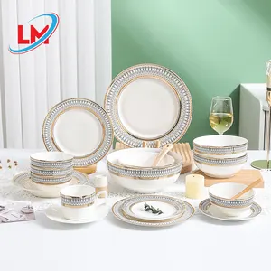 Juego de cena de oro de lujo para fiesta de boda, plato, taza, plato de cerámica de alta calidad con borde dorado, plato de porcelana blanca pura