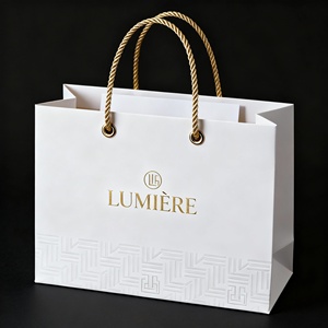 Premium White <b>Card</b> Foil Stamped Handbag Luxury Gift Bag with Elegant Gold <b>Embossing</b> - Product Image 1