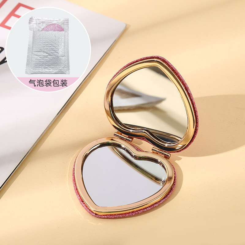 Cadre intérieur doré en forme de coeur rose + pochette à bulles