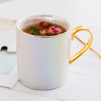Fourniture directe par le fabricant de tasses en céramique plaquée or en porcelaine blanche glaçure de perles tasses créatives à lait frais et à café pour les fêtes
