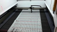Máquina de Corte Láser DTF de 90*70cm con Cámara CCD para Impresión por Transferencia de Calor en Película PET y Producción de Ropa Personalizada