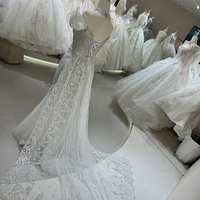 Robe de mariée sirène de luxe DW0021, nouvelle conception, dentelle illusion, épaules dénudées, broderie luxueuse, sequins et perles.