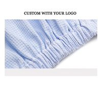 Jupe de bain en coton doux style gaufré avec logo brodé personnalisé pour SPA, avec boutons, blanche, pour la beauté et le soin du corps