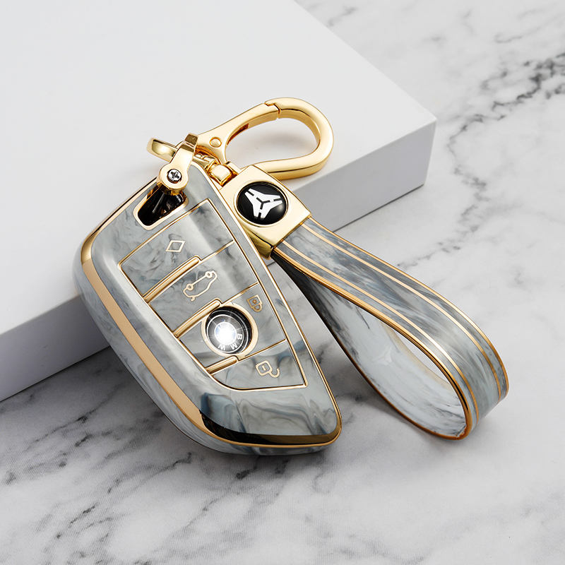 Cache bouton 4 boutons gris + porte-clés en TPU