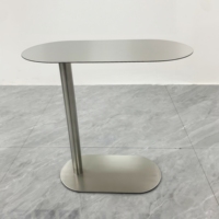 Table basse ovale simple et moderne en acier inoxydable avec base en fer pour hôtels et canapés de luxe pour meubles de maison