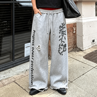 Pantalon de survêtement Ouna sur mesure, imprimé, effet vieilli, coupe large, patchwork, couleurs contrastées, double taille superposée