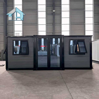 Maisonnette préfabriquée de 20 pieds à toit plat, 1 à 3 chambres, design moderne en panneaux sandwich, villa de luxe extensible en conteneur d'acier