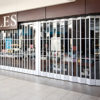 Porte accordéon transparente en polycarbonate pour devanture de magasin, moderne, avec cadre en alliage d'aluminium manuel
