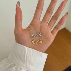 Colliers pendentifs Dylam au design géométrique élégant en argent S925 avec chaîne à maillons et zircone cubique 5A, symbole de l'infini en forme de papillon et chiffre 8 - Product Image 2