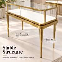 Table de présentation de bijoux en acier inoxydable doré de luxe sur mesure, vitrine à bijoux en verre trempé pour boutique