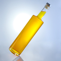 Vente directe usine – Bouteille cylindrique haute en verre 750 ml la plus vendue pour le stockage du whisky, du rhum et du brandy avec bouchon en liège personnalisé