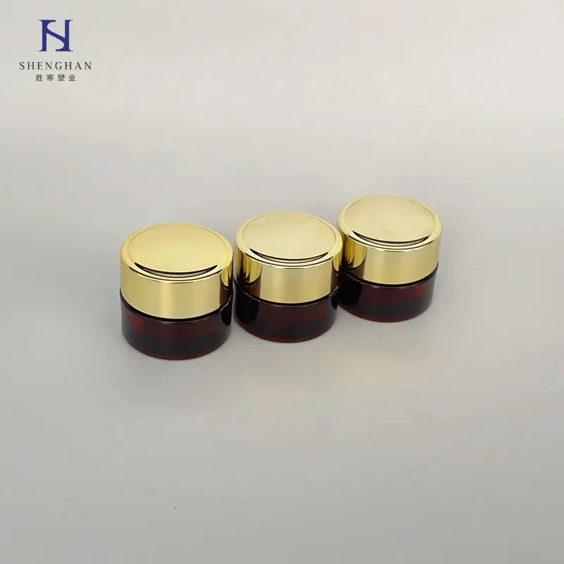 newest Small Luxury 5g New Gold Petg Plastic Cosmetic Packaging Eye Cream Jars amber body bottle frosted bottom with gold cap