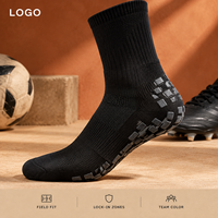 Chaussettes de football renforcées noires mi-mollet avec coussinets internes et externes pour une adhérence optimale sur le terrain, profil mince, adaptées aux crampons, avec tableau de tailles