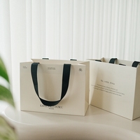 Sac de shopping en papier de luxe écologique personnalisé avec poignée en ruban, finition mate laminée, emballage cadeau pour cosmétiques, vêtements, bougies, vente au détail