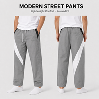 Pantalon de survêtement léger personnalisé OEM pour homme, style décontracté, patchwork, sportswear, plissé, coupe ample, jambe large, en nylon brodé